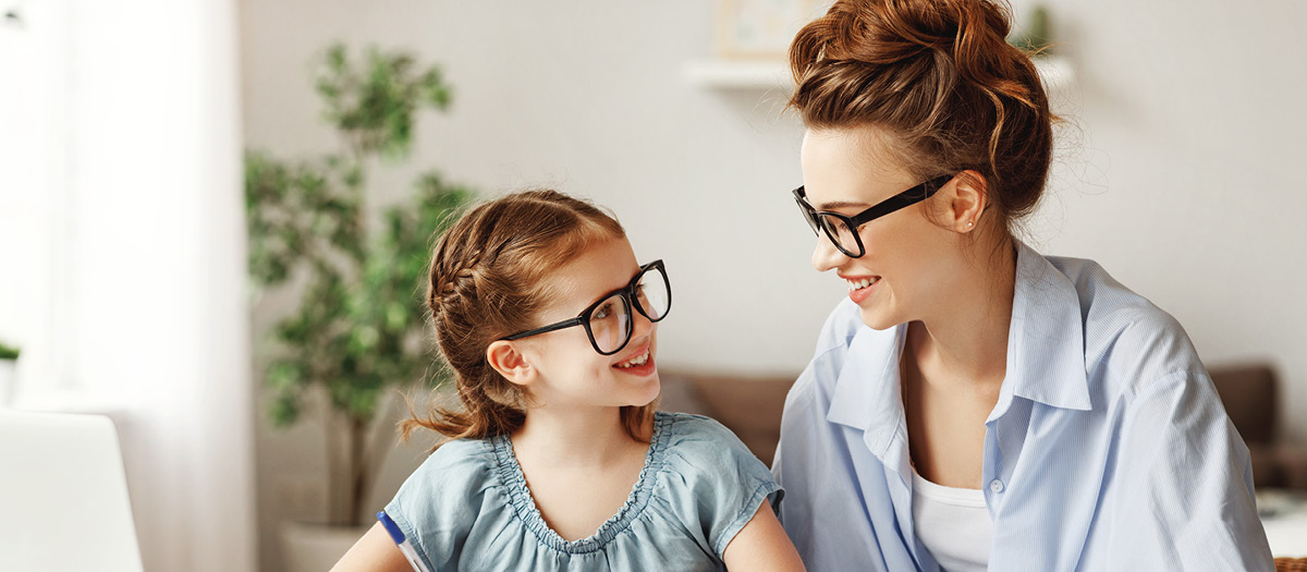 mother and daughter smiling