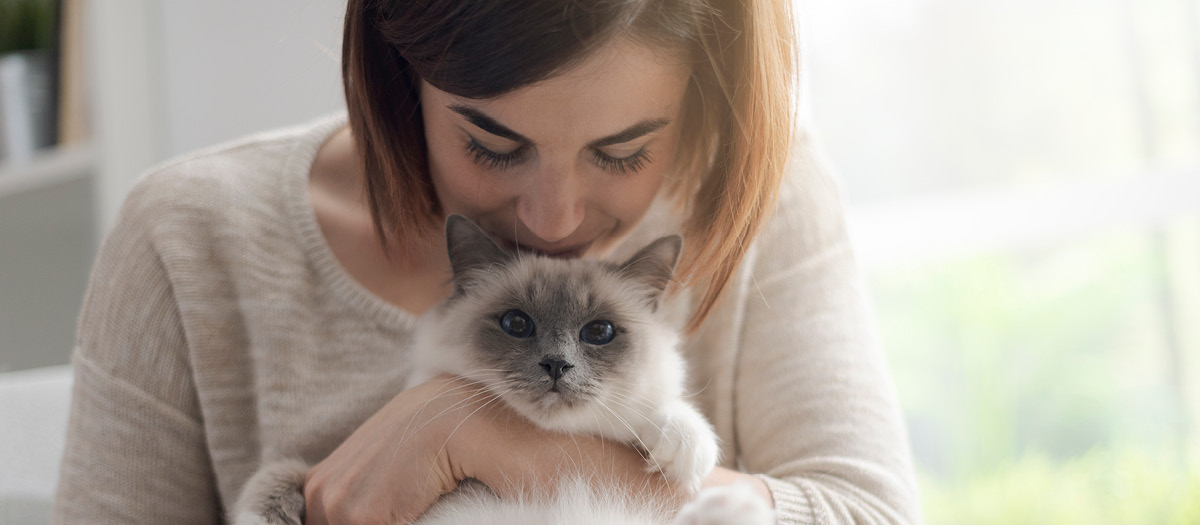 woman with pet cat