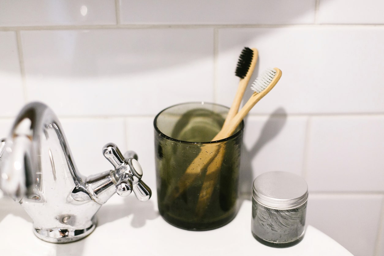 natural toothbrushes near sink